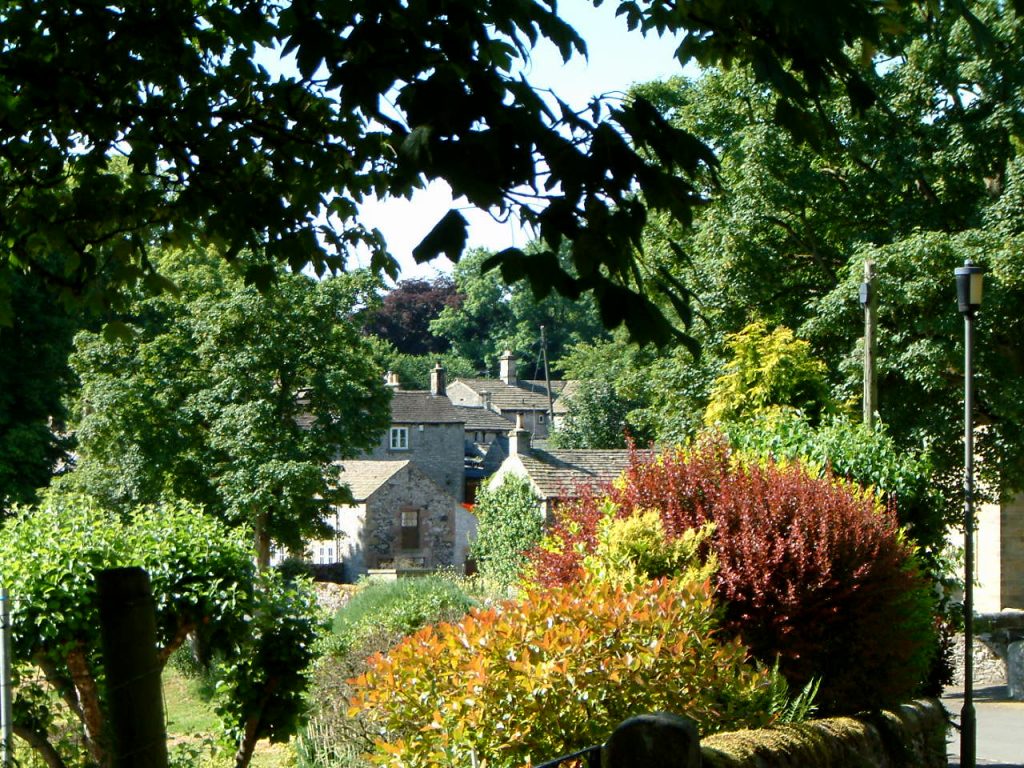 A view of Middleton through colourful Autumn trees